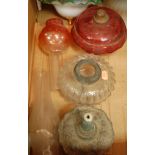 A box of miscellaneous oil lamp parts to include; clockwork brass pedestal lamp base,