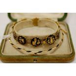 An early 20th century Egyptian boxed gilt metal and enamel bracelet together with a yellow metal