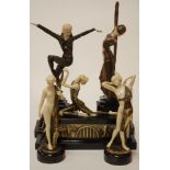 An Art Deco style figure of a dancer in standing pose with arms aloft on a marble base,