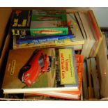 A box of assorted books being mainly motoring related