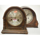 A 1920s oak cased mantel clock having a silvered dial and Arabic numerals together with a 1930s oak