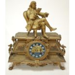 A late 19th century French gilt metal mantel clock having enamelled dial with Roman numerals