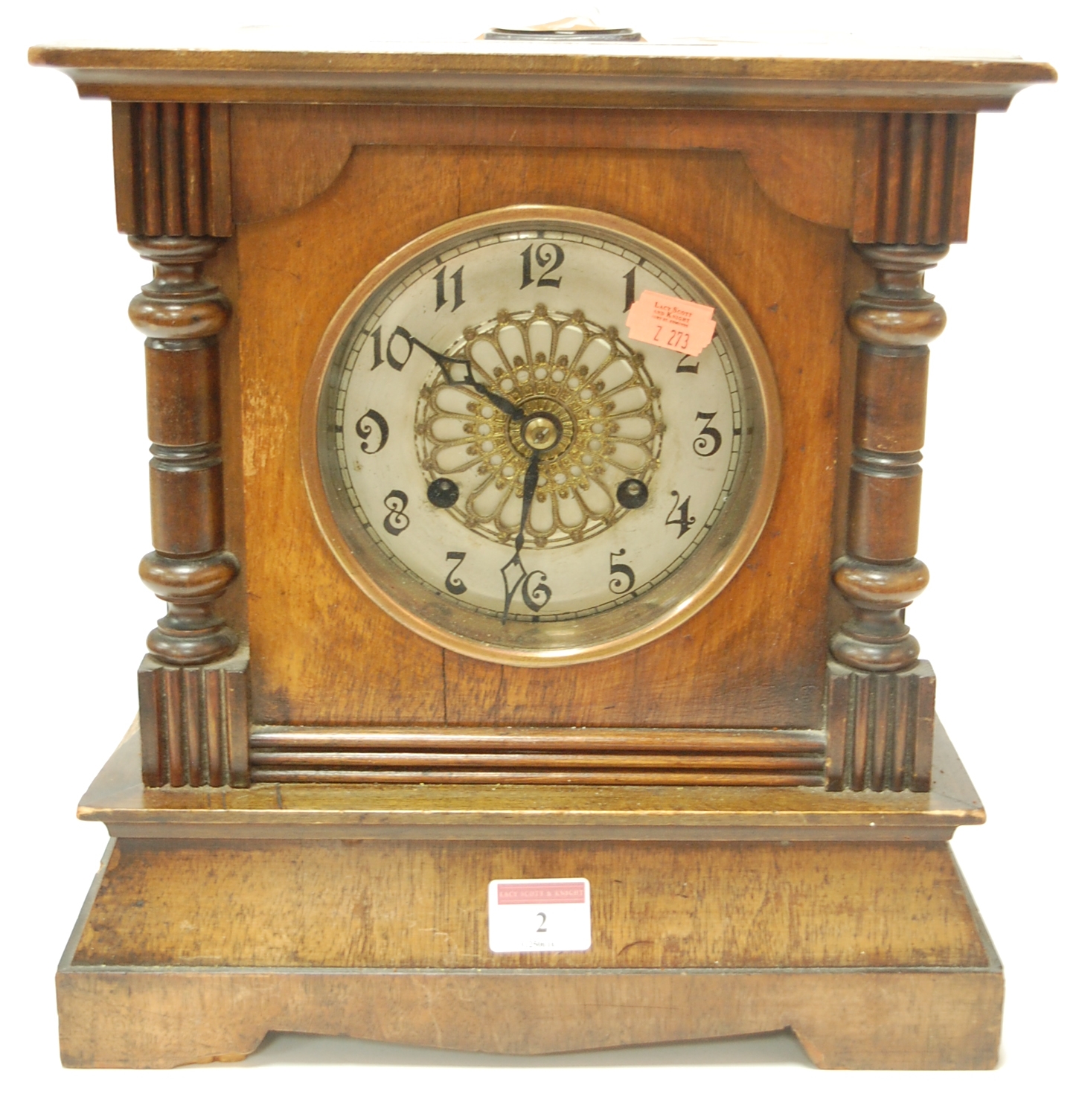 A late 19th century Continental walnut cased mantel clock having silvered dial with Arabic numerals