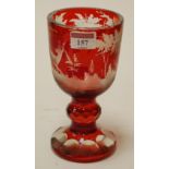 A late 19th century acid etched and wheel engraved rouge glass goblet