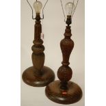 A carved oak table lamp base together with one other (2)