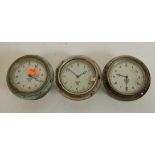 A Smiths instrument panel clock having a silver dial with Arabic numerals signed Smiths,