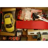 A box of miscellaneous children's toys to include Bburago Volkswagen Beetle, tin plate police car,