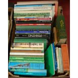 A box of assorted books to include fishing related examples