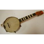 A mid 20th century banjo in leather case