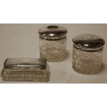 An early 20th century cut glass and silver topped dressing table tidy together with two other