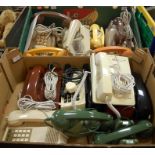 Two boxes of assorted vintage telephones