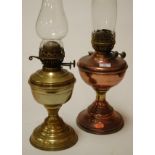 An early 20th century lacquered brass pedestal oil lamp;