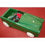 A 1950s green painted tin plate child's pedal car