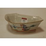 A Chinese stoneware bowl decorated with a figural landscape