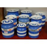 A collection of assorted Cornish ware storage jars to include rice, sugar, currants,