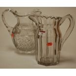 A late 19th century cut glass water jug together with one other (2)