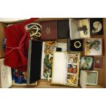 A large collection of assorted costume jewellery to include hardstone set brooches,