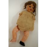 A mid 20th century British made bisque head child's doll with composition body (a/f)