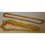 A beaded faux amber necklace together with beaded glass or hardstone necklace (2)