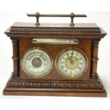 A late 19th century walnut cased combination clock barometer (dial a/f)