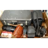 A collection of assorted cameras and equipment to include Russian photo sniper lens cased,