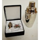 A modern white metal mounted bottle stopper and matching napkin ring together with an Art Deco