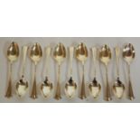 A set of eleven early 20th century silver dessert spoons