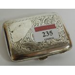 A ladies silver pocket cigarette case with all over engraved foliate decoration