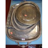 A large late Victorian twin handled serving tray with all over C-scroll decoration together with