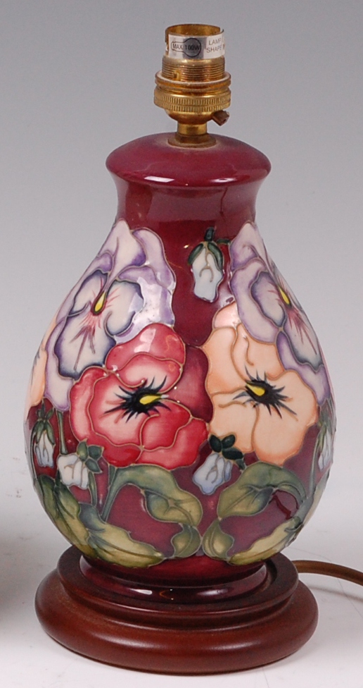 A modern Moorcroft pottery table lamp, in the Pansies on Maroon pattern,