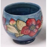 An early 20th century small Moorcroft pottery jardiniere, in the Anemone pattern,