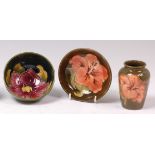A Moorcroft small pottery shallow footed table bowl, in the Hibiscus pattern,