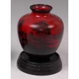 A Royal Doulton flambe glazed ceramic vase, of bulbous tapering form,