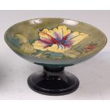 An early 20th century Moorcroft pottery comport, in the Hibiscus pattern,