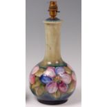 An early 20th century Moorcroft pottery table lamp, in the Anemone pattern,