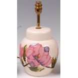 A modern Moorcroft pottery table lamp, in the Magnolia pattern,
