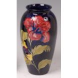 A Moorcroft pottery vase, in the Hibiscus pattern, of slightly ovoid tapering form,