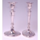 A pair of silver candlesticks in the Adam style, each having detachable sconces,