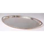 A George V silver twin handled drinks tray, having raised and reeded gallery, 70oz,