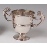 A late Victorian silver twin handled pedestal trophy cup, having single reeded band, 12.