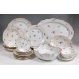 An extensive late 19th century Meissen porcelain part dinner service, comprising; 20 dinner plates,