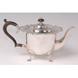 An Edwardian silver bachelors teapot, having a pierced flat rim, walnut S scroll handle,