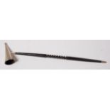 A silver conical candle-snuffer on turned and spiral fluted whalebone handle,