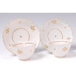 A pair of Flight & Barr Worcester tea bowls on stands,