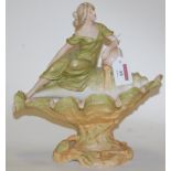 An early 20th century Royal Dux porcelain basket, in the form of a maiden upon a conch shell,