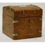 A Victorian oak and brass bound dome-top unfitted box