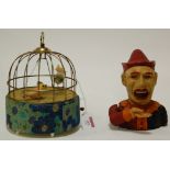 A reproduction bird automaton together with a cast iron novelty moneybox (2)