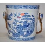 A Victorian blue and white transfer decorated slop pail and cover in the Willow Pattern