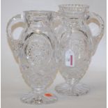 A pair of early 20th century cut glass twin handled vases (a/f)