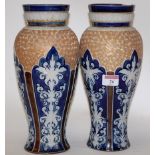 A pair of Doulton Lambeth stoneware vases, of baluster form,